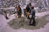 India - Ladakh - Jammu and Kashmir: construction workers preparing mortar - photo by W.Allgwer