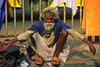 India - Calcutta / Kolkata (West Bengal): a beggar in the front of Howard train station - photo by E.Petitalot