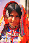 India - Gujarat, India: Harijan girl with covered head and typical jewels and clothes - photo by E.Petitalot