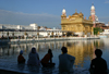 India - Amritsar (Punjab): Golden Temple - evening view of the Sarovar lake and the causeway - photo by E.Andersen