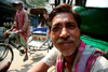 Calcutta / Kolkata, West Bengal, India: face of rickshaw driver waiting for costumers - photo by G.Koelman