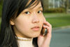 Bali, Indonesia: young Indonesian Asian woman talking on a cellular phone - Model Released - photo by D.Smith