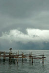 Indonesia - West Sumatra: Lake Maninjau - a storm arrives - fishing nets - caldera lake west of Bukittinggi - photo by P.Jolivet