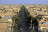 Iran - Yazd: view from a minaret - avenue leading to the Dasht-e Kavir desert - clay brick architecture - photo by W.Allgower