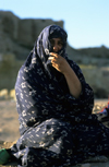 Iran - Fars province: nomadic woman with chador - photo by W.Allgower