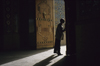 Iran - Shiraz: Shah-e-Cheragh mausoleum - man kissing the door - photo by W.Allgower