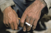 Iran: hands and cigarette - photo by W.Allgower