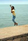 Iran - Hormuz island: a girl jumps into the Persian gulf - photo by M.Torres