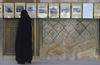 Iran - Isfahan: woman at a photo exhibition - photo by W.Allgower