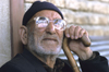 Iran: man with thick glasses - photo by W.Allgower