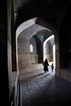 Isfahan, Iran: woman and child walk along a vaulted passage - photo by G.Koelman