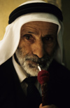 Israel - Jerusalem - old Arab man smoking a water pipe - photo by Walter G. Allgwer