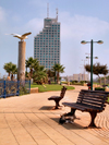 Netanya, Center district, Israel: waterfront promenade - benches and modern building - photo by E.Keren