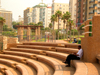 Netanya, Center district, Israel: black man sitting at the open air theatre - photo by E.Keren
