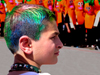 Israel: boy with multi-colored hair and Purim cortege - photo by E.Keren