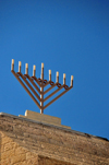 Jerusalem, Israel: Menorah atop the Yeshivat Hakotel - Jewish quarter - Blue sky background and copy space for your text - photo by M.Torres
