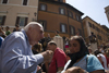 Rome, Italy: old man telling off gypsy woman in Fontana di Trevi - photo by I.Middleton