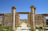 Jerash - Jordan: gate - view of the modern city - Roman city of Gerasa - photo by M.Torres