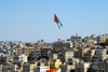 Amman - Jordan: Jordanian flag over the city - photo by M.Torres