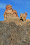 Kazakhstan, Charyn Canyon: Valley of the Castles - harder, darker volcanic rock at the bottom and eroded red sedimentary rocks at the top - photo by M.Torres