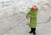 Kazakhstan - Chimbulak ski-resort, Almaty: woman using a rope to walk on the ice - photo by M.Torres