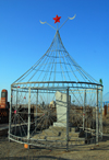 Kazakhstan, Shelek, Almaty province: Muslim cemetery - caged tomb with Islamic crescents and Soviet star - photo by M.Torres