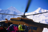 Kazakhstan - Tian Shan mountain range: mountaineers board a russian Mil Mi-8 Hip helicopter to leave from the Khan-Tengri base camp - photo by E.Petitalot