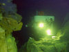 Kingman Reef: Pisces IV battery-powered submersible at rest between two pillars at 320 meters depth - underwater photo by NOAA / NURP (in P.D.)