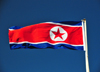 Pyongyang, North Korea / DPRK: the flag of the Democratic People's Republic of Korea flies in a deep blue sky - photo by M.Torres