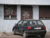 Serbia - Kosovo - Kosovska Mitrovica: Serbian house and car registration - photo by A.Kilroy