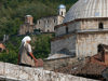 Kosovo - Prizren / Prizreni: woman on the bridge and dome of the Sinan Pasha mosque - photo by J.Kaman
