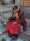 Kosovo - Prizren / Prizreni: old lady with a cigarette - photo by J.Kaman