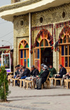 Erbil / Hewler, Kurdistan, Iraq: people enjoy a tranquil moment at Machko Chaikhana, the historic teahouse located at the foot the citadel, on the edge of Shar Park - this teahouse has been a traditional meeting point for the city's intellectuals, journalists, government officials, politicians and foreigners - open since the 1940s and named after its founder Machko Muhammed - photo by M.Torres