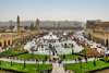 Erbil / Hewler / Arbil / Irbil, Kurdistan, Iraq: main square, Shar Park, with crowds enjoying the pleasantly cool area created by the fountains - arcades on both sides and Nishtiman mall in front - Mosque and Erbil Clocktower on the left - seen from the Erbil citadel - photo by M.Torres