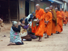Muang Noi, Laos: Buddhist monks collecting alms - photo by P.Artus