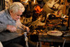 Lebanon, Sidon: artisan fixing a hookah water pipe in workshop - photo by J.Pemberton