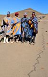 Mohale Dam, Lesotho: four shepherds pose on the road side - photo by M.Torres