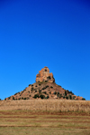 Thaba Bosiu, Lesotho: Qiloane pinnacle, hill crowned by a pillar of Cave Sandstone, in the middle of a corn field - photo by M.Torres