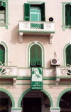 Libya - Tripoli: balconies over Green Square - Khadaffi poster (photo by M.Torres)