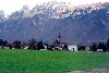Liechtenstein - Ruggell: from the fields - St. Fridolin's Parish Church - Swiss Alps in the background (photo by M.Torres)