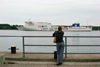 Lithuania - Klaipeda: girl looking at ferry - Lisco Gloria - Lisco Baltic Service - photo by A.Dnieprowsky
