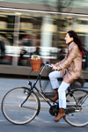 Lithuania - Vilnius: woman riding a bicycle - Gediminas' avenue - photo by Sandia