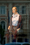 Vilnius, Lithuania: mannequin and buildings reflected in shop window - photo by J.Pemberton