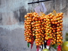 Macau, China: fruit hanging at a street vendor stall - photo by M.Torres