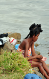 Soanierana Ivongo, Analanjirofo, Toamasina Province, Madagascar: young woman washing herself in the river - photo by M.Torres