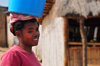 West coast road between the Manambolo river and Belon'i Tsiribihina, Toliara Province, Madagascar: Sakalava woman carrying a blue bucket on her head - photo by M.Torres