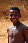 West coast road between the Manambolo river and Belon'i Tsiribihina, Toliara Province, Madagascar: boy with a broad smile - photo by M.Torres