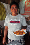 Vohilava, le Sainte Marie / Nosy Boraha, Analanjirofo region, Toamasina province, Madagascar: the owner of a small restaurant brings prawns to the table - Malagasy dish - photo by M.Torres