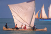 Morondava, Region of Menabe, province of Toliara, western Madagascar: tourists enjoy sailing on a traditional outrigger canoe - photo by R.Eime