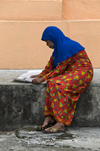 Kuala Lumpur, Malaysia: Malay Muslim woman reading a newspaper - photo by J.Pemberton